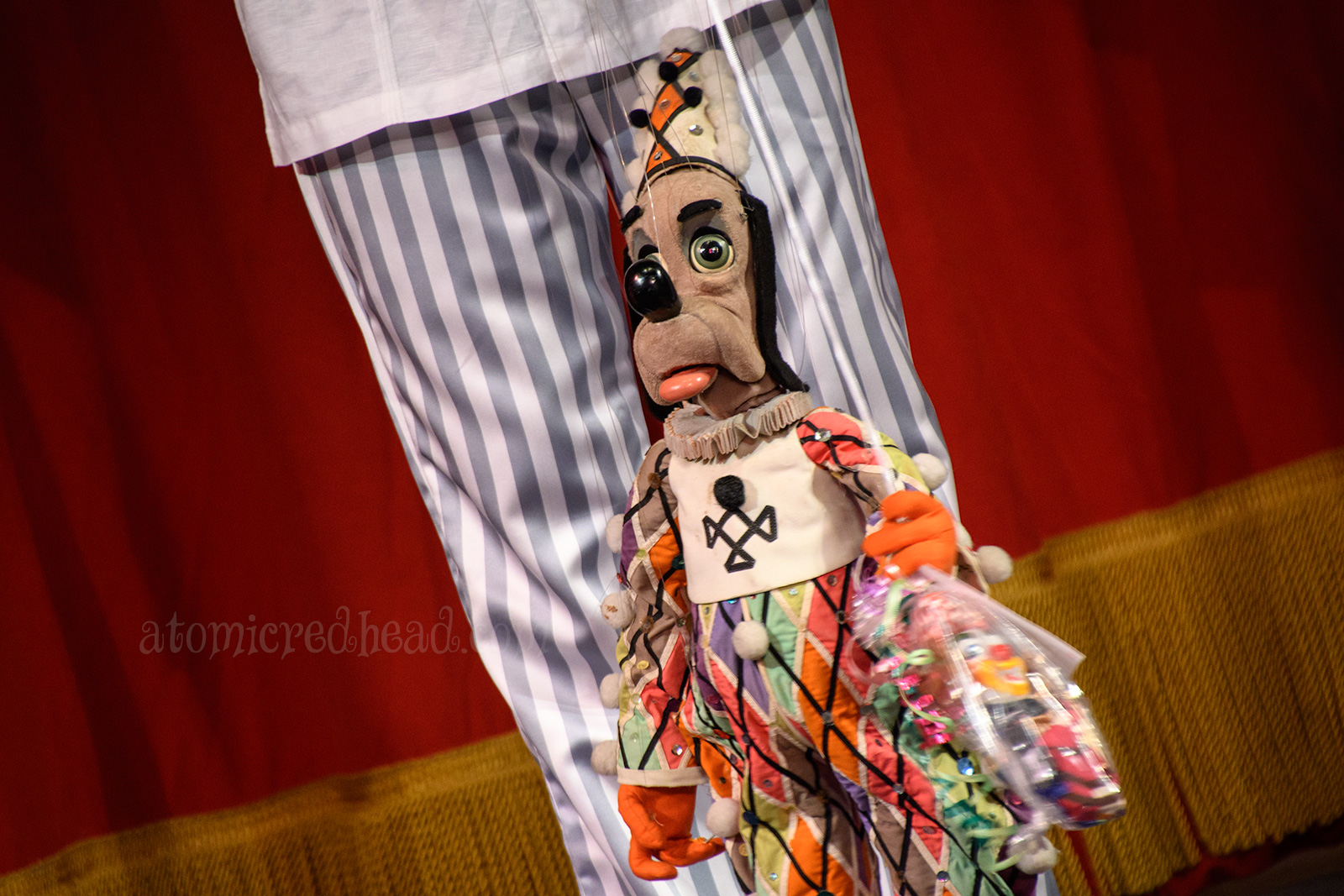 Happy the Birthday Dog marionette greets my friend with a gift of a clown marionette.