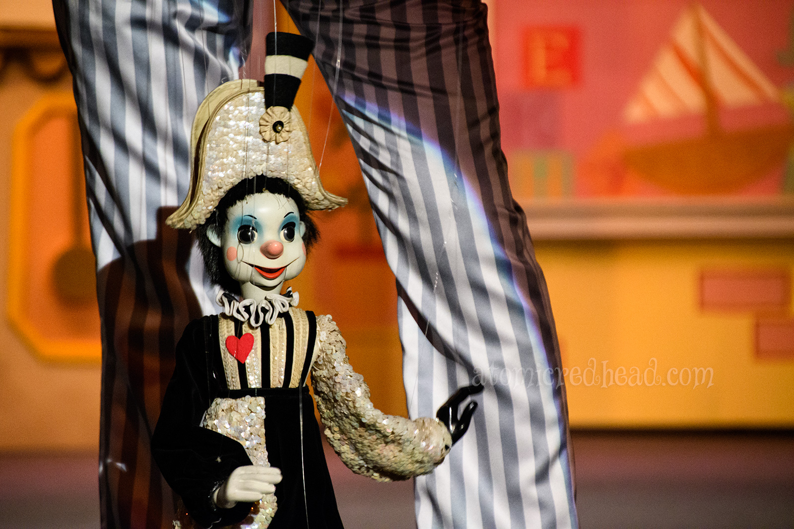 A harlequin marionette.