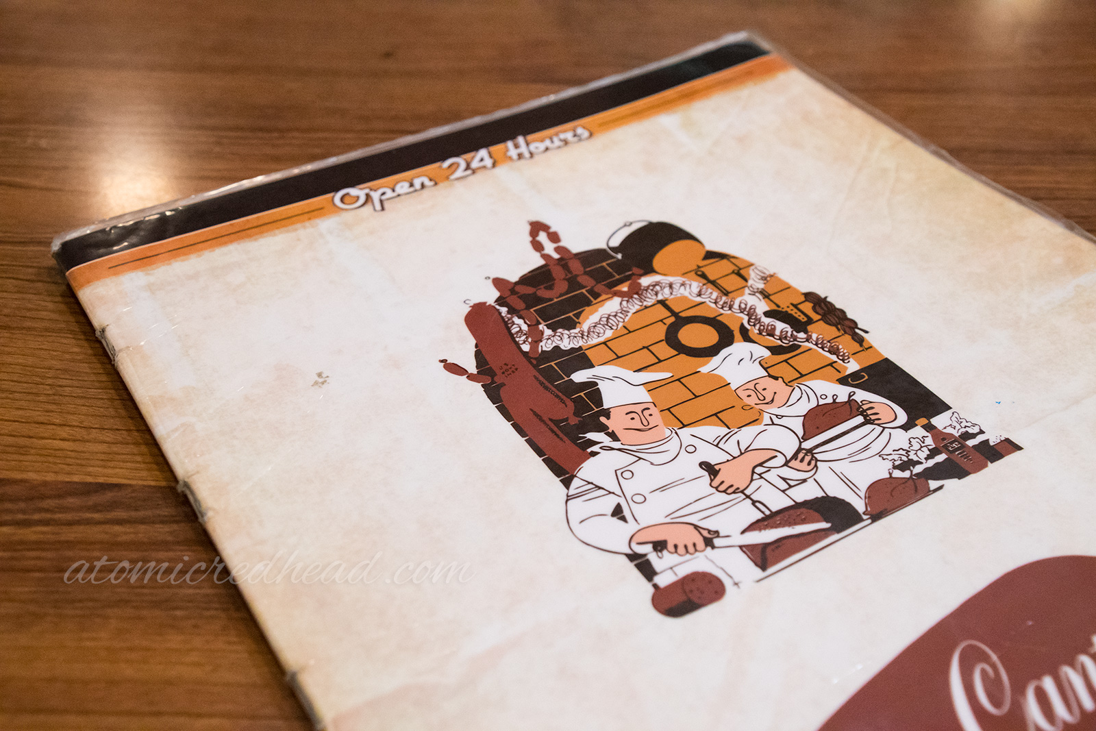 Canter's menu, featuring an illustration of two chefs surrounded by sausages and bread.