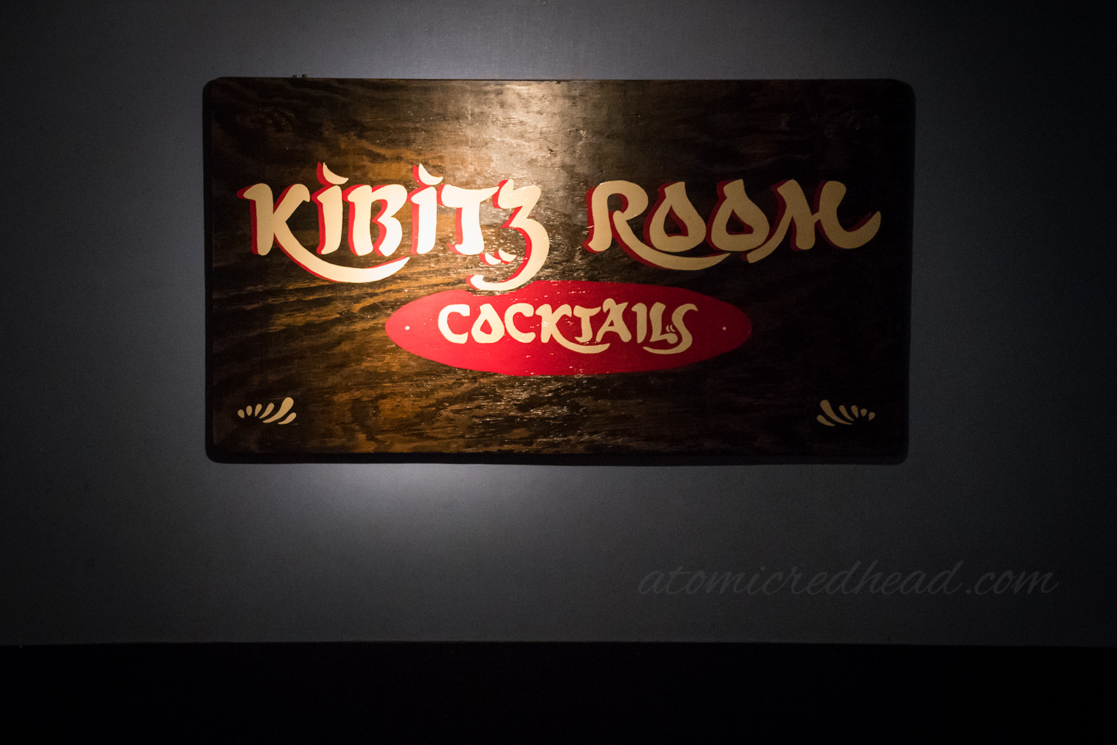 Kibitz Room sign inside located on the wall behind the small stage