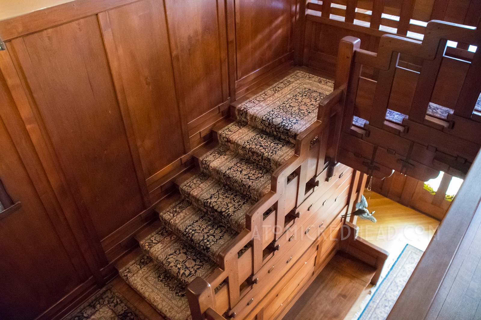 The central staircase, where the rail is also a stair step pattern.