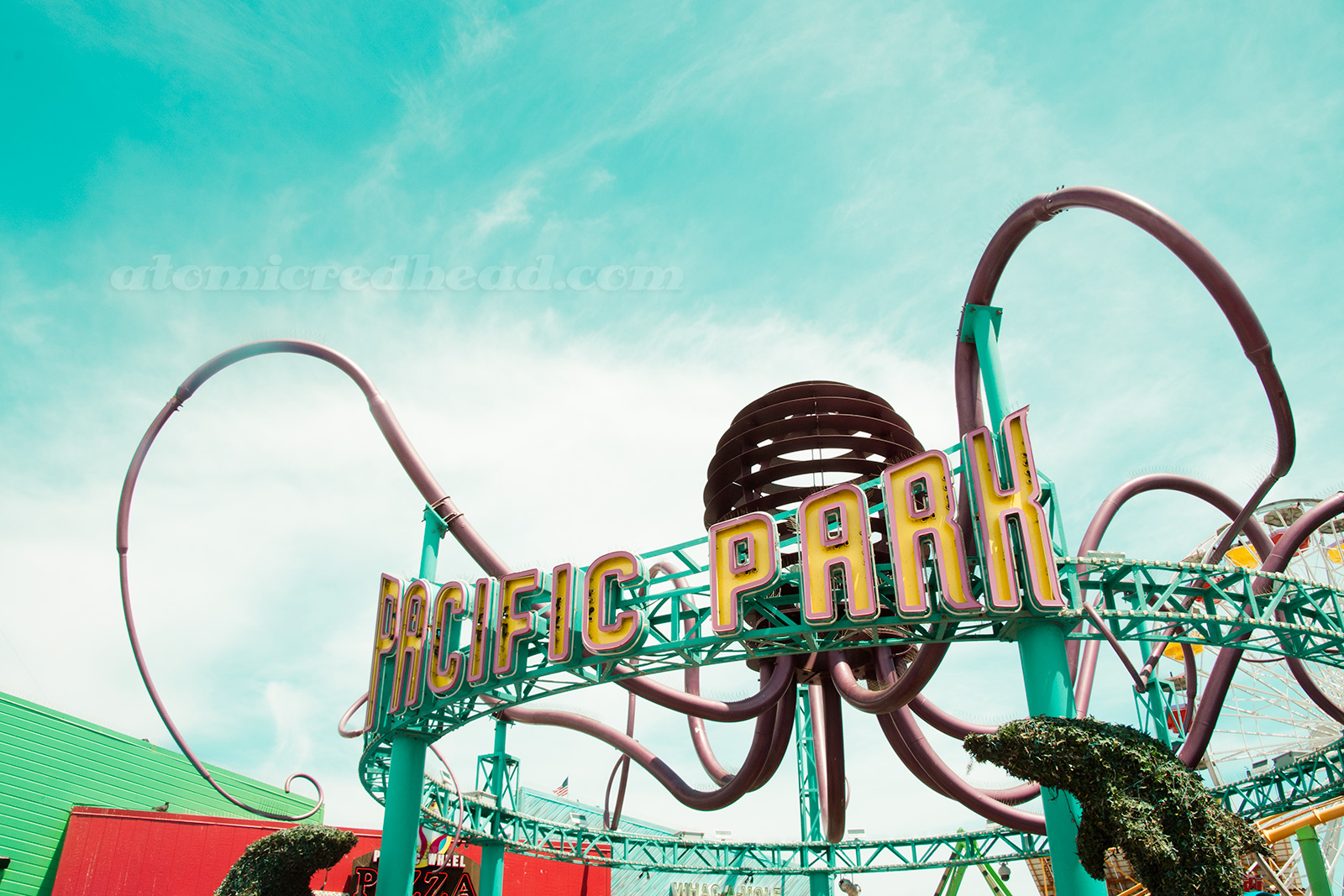 Entrance to Pacific Park, a large abstract octopus sculpture high above the arch.