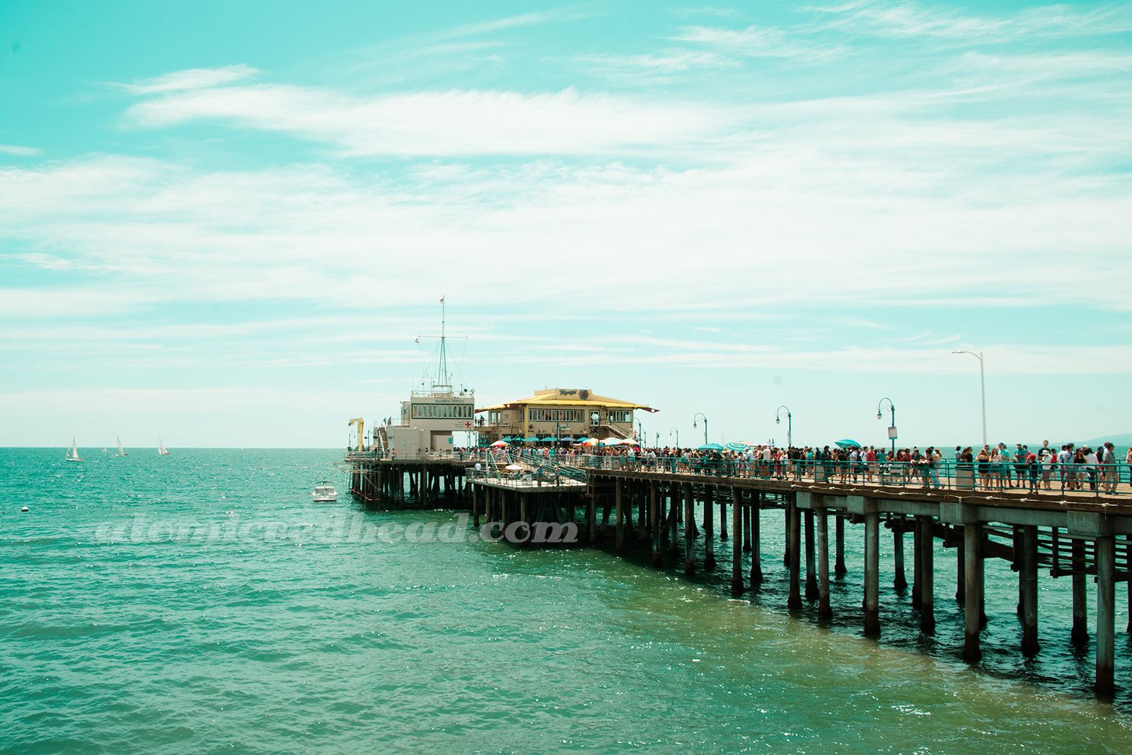 The fishing pier stretches over the water.