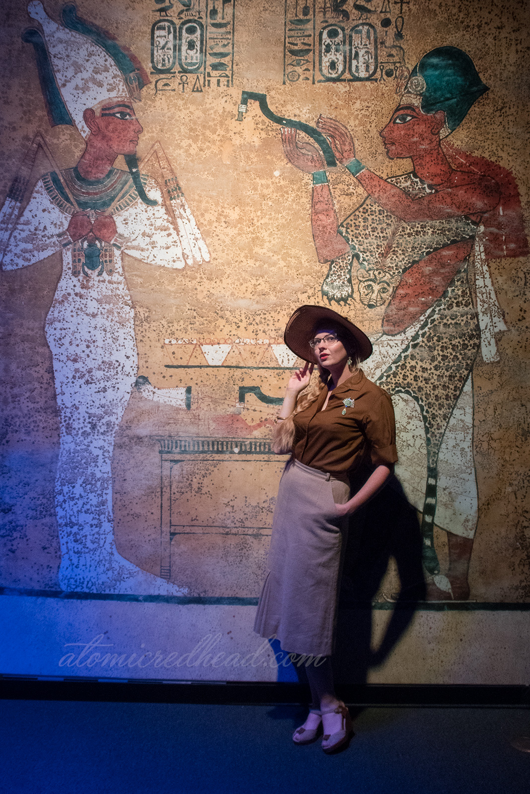 Me, standing against a backdrop that looks like the walls of an Egyptian tomb.