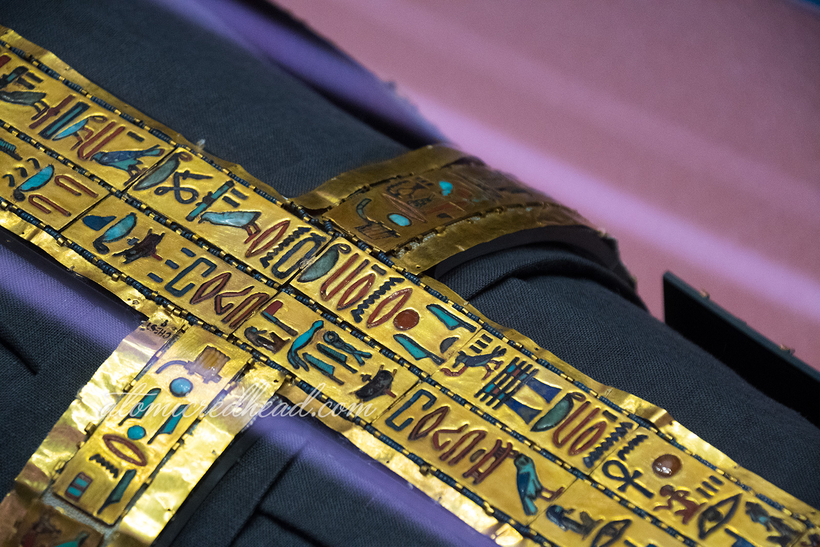 Close up of some hieroglyphics that were placed on his body, made of gold.