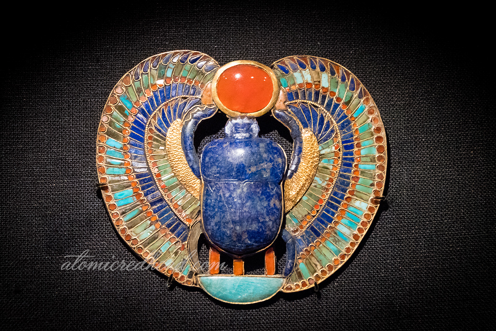 A brooch of a winged scarab.