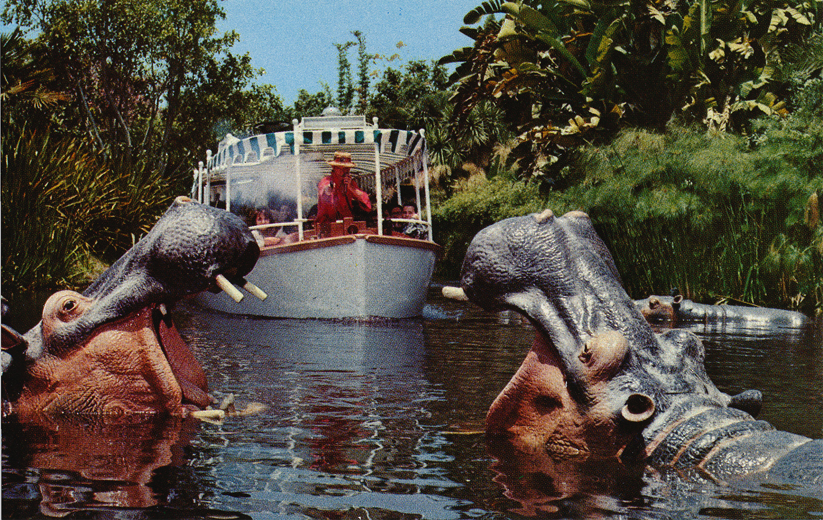 A Jungle Cruise skipper shoots at hippos.