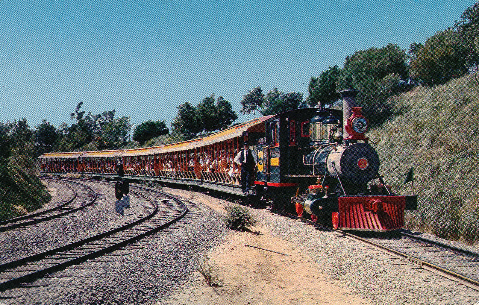 One of the Disneyland trains rounding a corner.