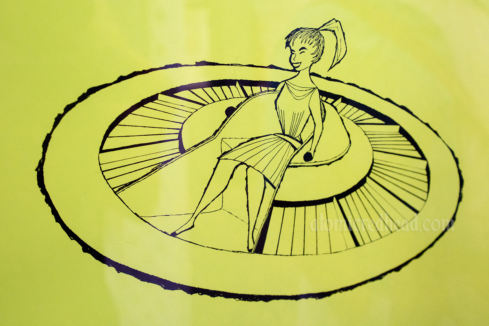 Close-up from the Flying Saucers attraction poster, features a girl in a UFO like ride vehicle.