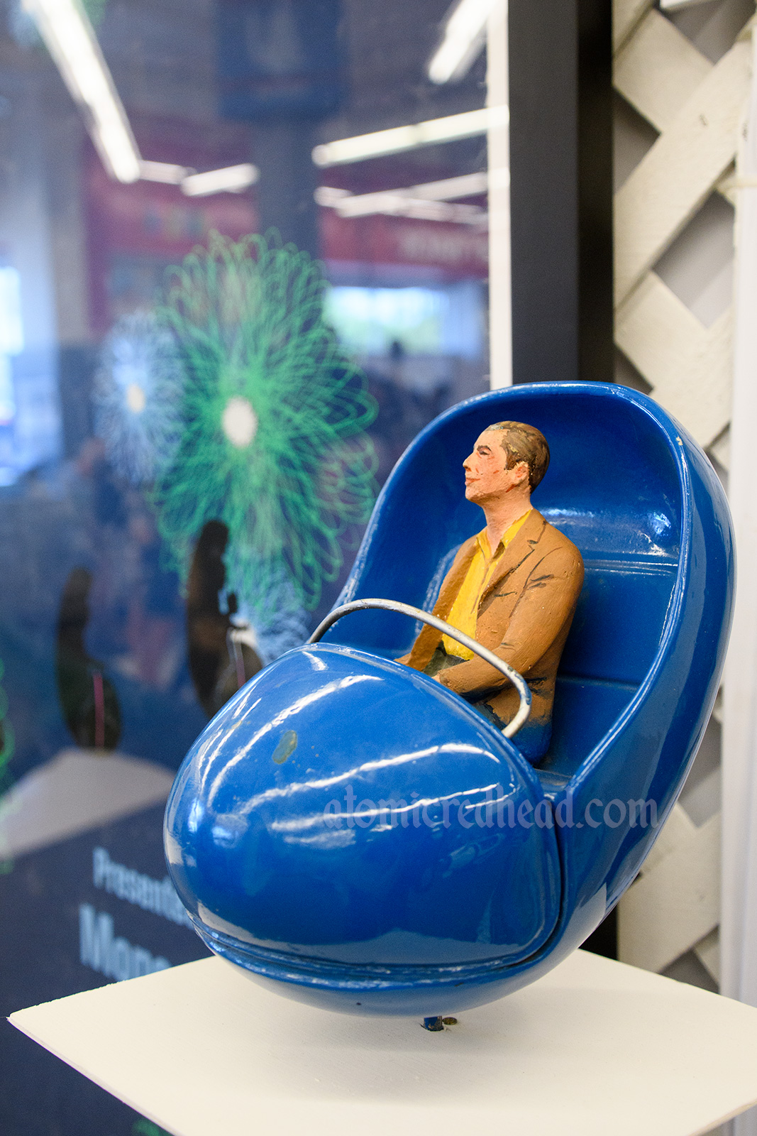 Adventure Thru Inner Space Atomobile prop - a small ride vehicle with a figure sitting in it. Guests boarded one just like it, and were "shrunk." In the queue Guests saw the vehicles "shrink" with tiny versions, like this one, appear.