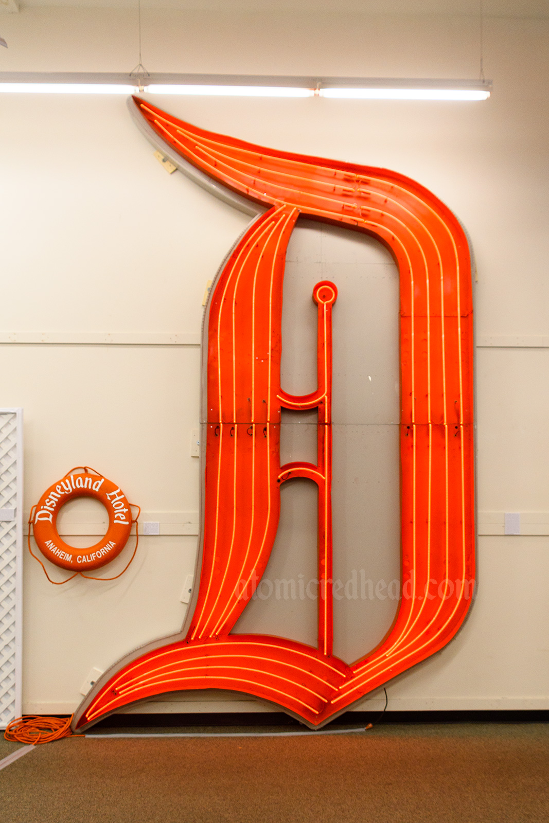 Large red neon D that once hung on the Disneyland Hotel.
