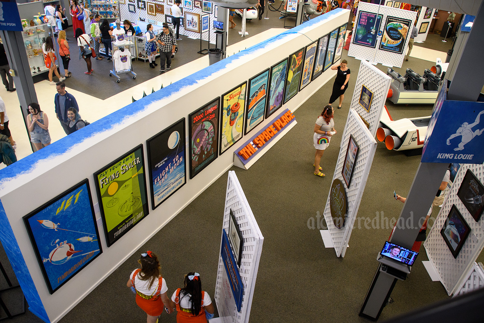 Overview of the exhibit, featuring various attraction posters, signage and more.