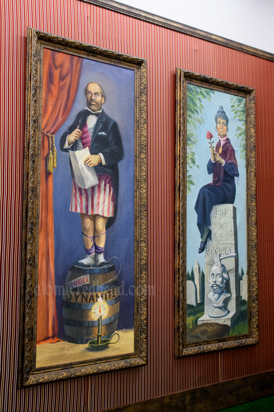 Haunted Mansion stretching posters - a man standing on a barrel of dynamite and candle lighting the wick. A woman sits upon her husband's tombstone, the likeness of her husband has an ax in his head.