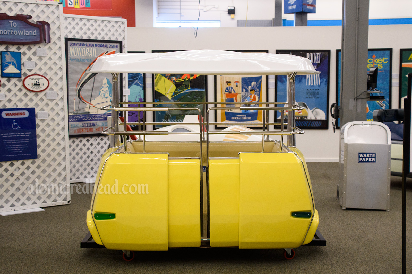 Yellow PeopleMover ride vehicle. 