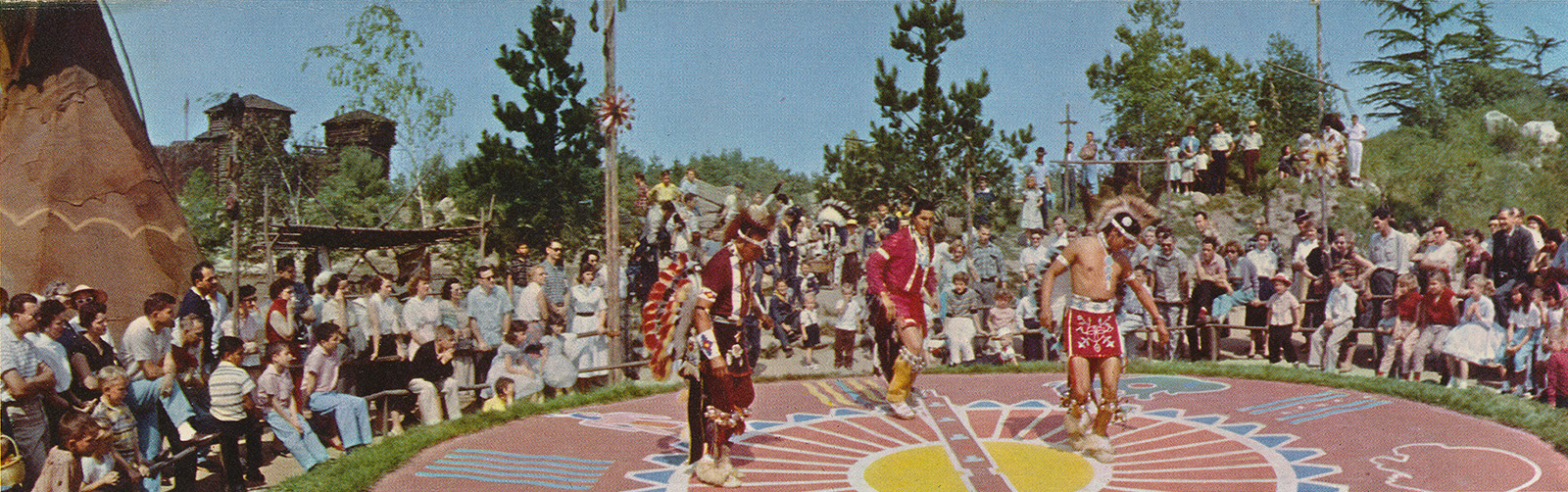 Native Americans dance in the ceremonial circle.