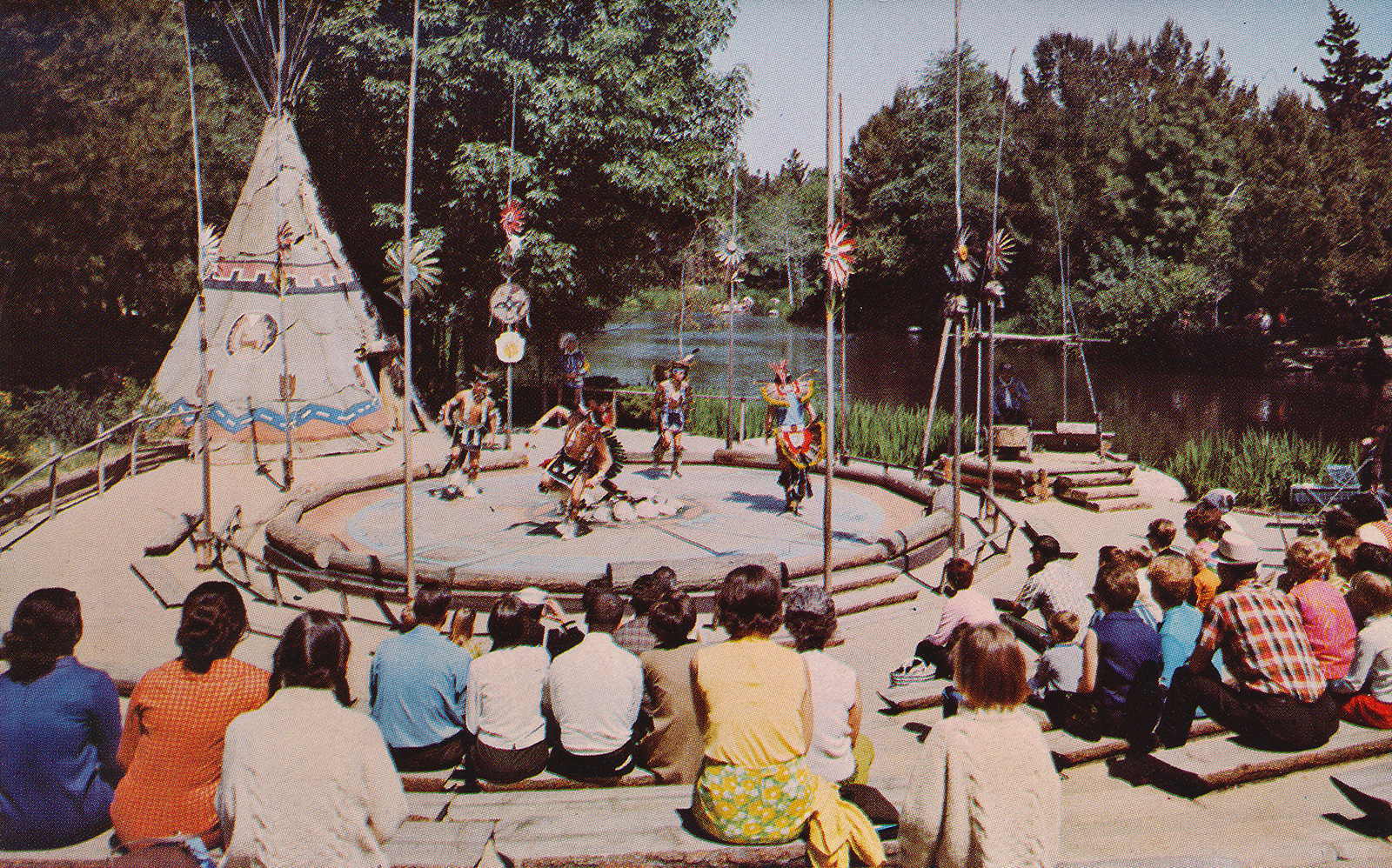 Native Americans dance in the circle, with tipis to the left, and the Rivers of America on the right.