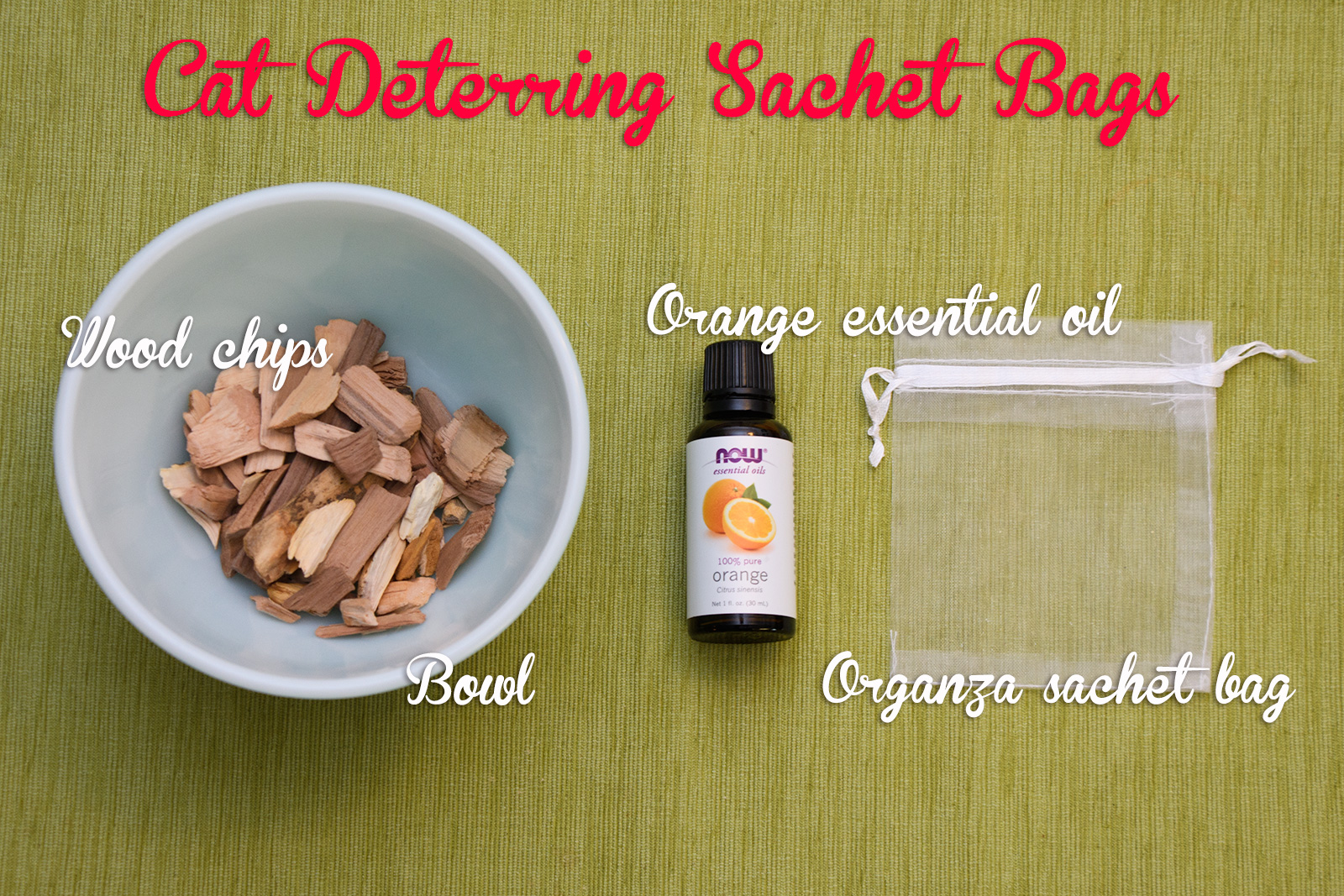 On the left a bowl is filled with wood chips, next to it a bottle of orange essential oil, next to it an empty organza bag. Text reads: Cat Deterring Sachet Bags, Wood chips, Orange essential oil, Organza sachet bag, bowl