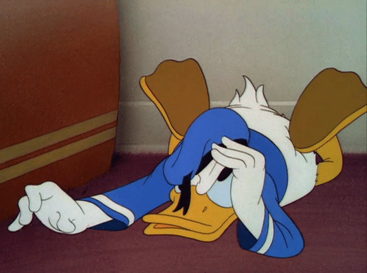 Donald huffs on the floor, tapping his fingers, looking annoyed at his radio.