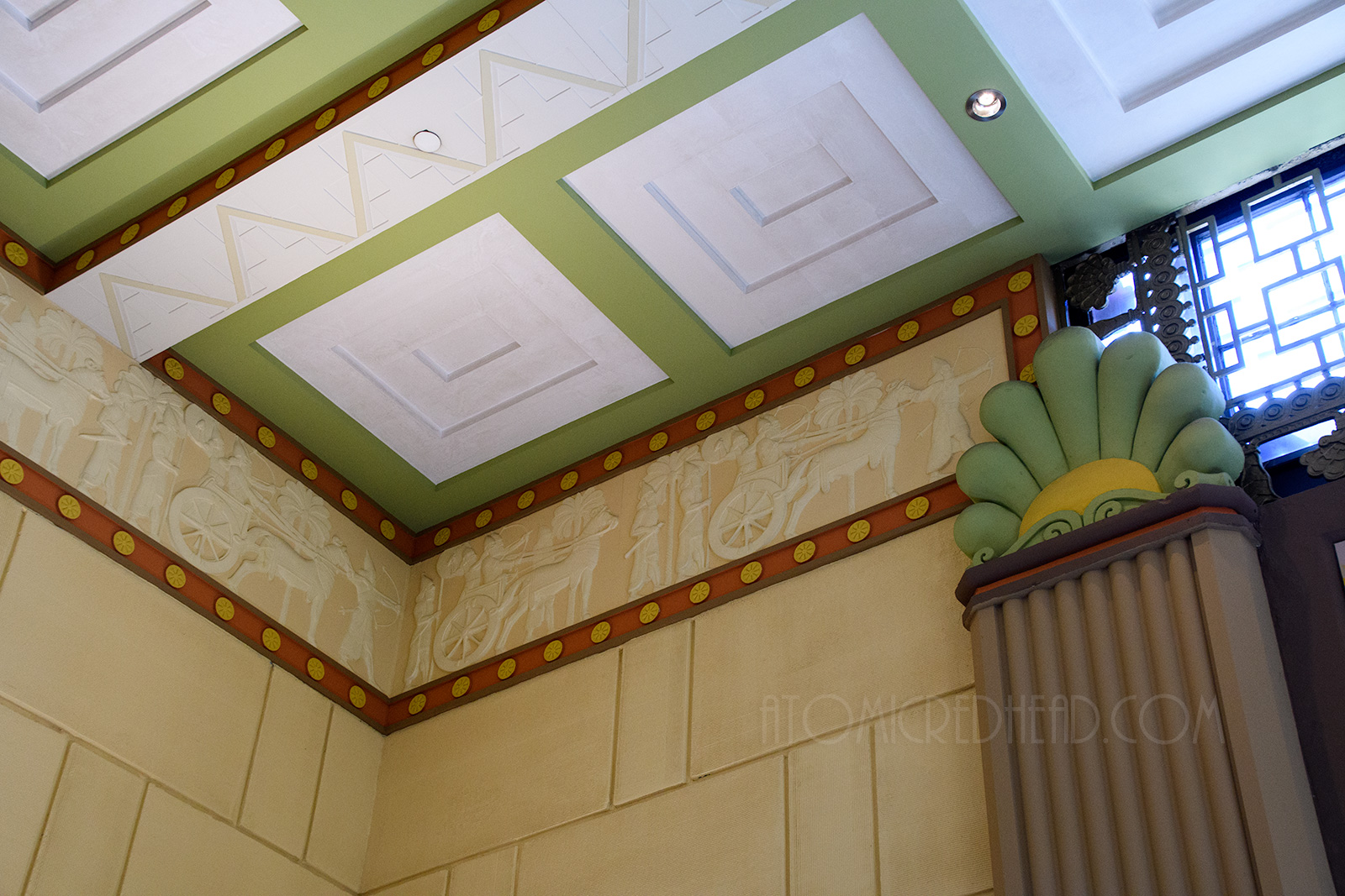 Carvings of chariot races and warriors line the tops of the walls.