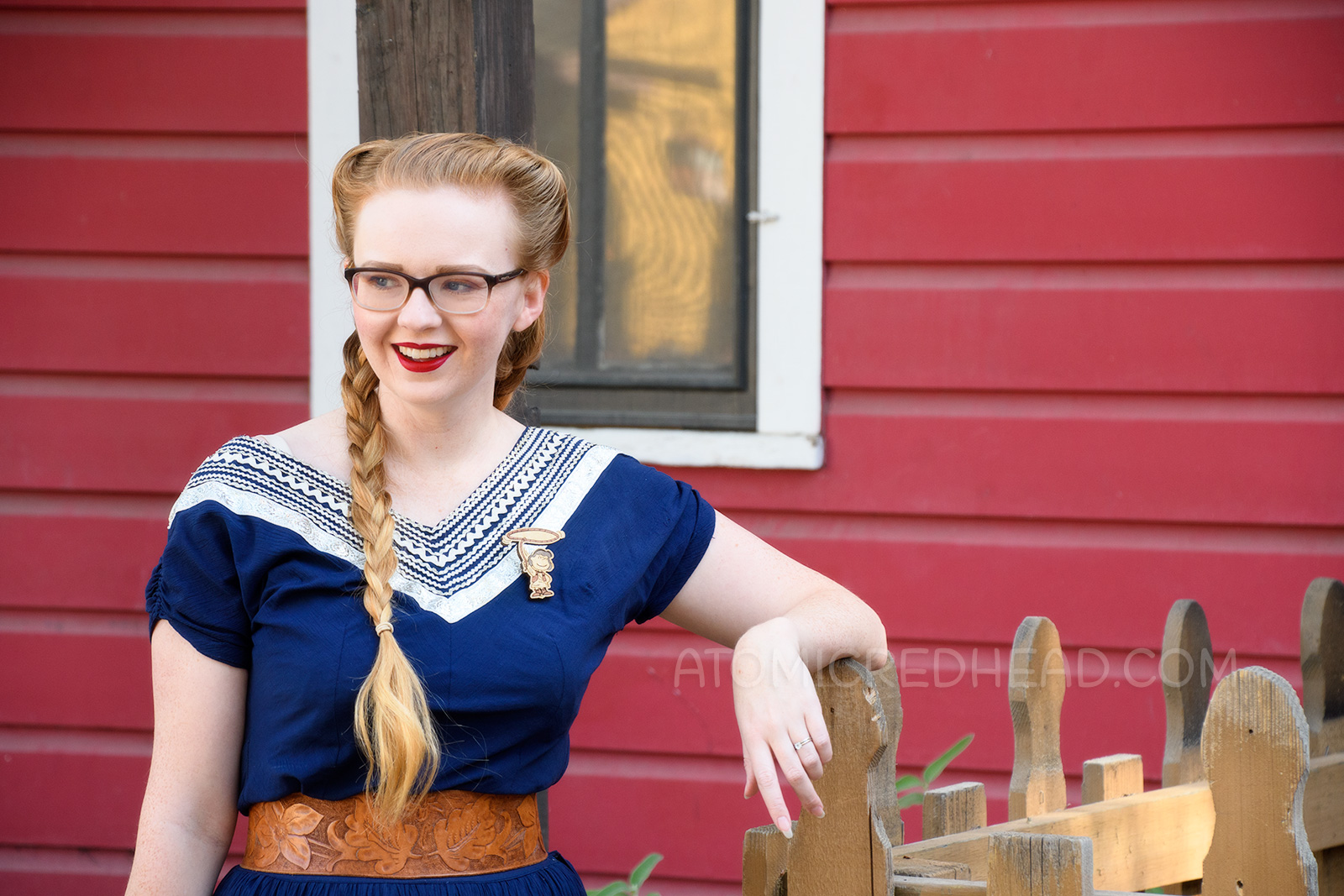 Myself wearing a navy colored patio set with silver ric-rac trim, and a tooled leather belt, purse, and shoes.
