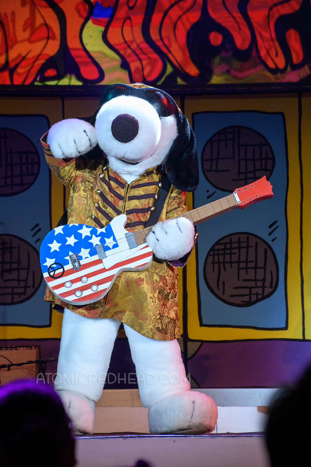Snoopy arrives on stage as "Jimi Hound-rix" during the Woodstock's Music Festival stage show.