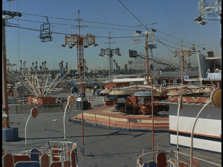 Screencap: Various rides, including a ski lift type that allows people to ride above the park.