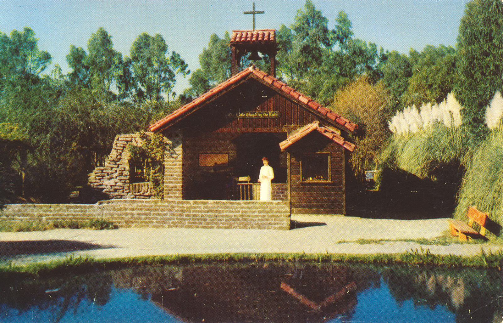 The Little Chapel by the Lake, a small adobe brick church with red tile roof.