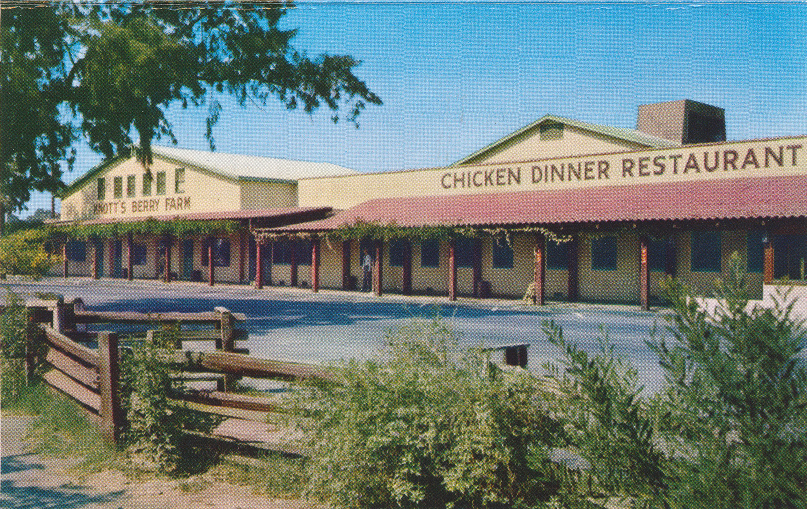 Mrs. Knott's Chicken Dinner Restaurant, a yellow adobe building with red tile roof.