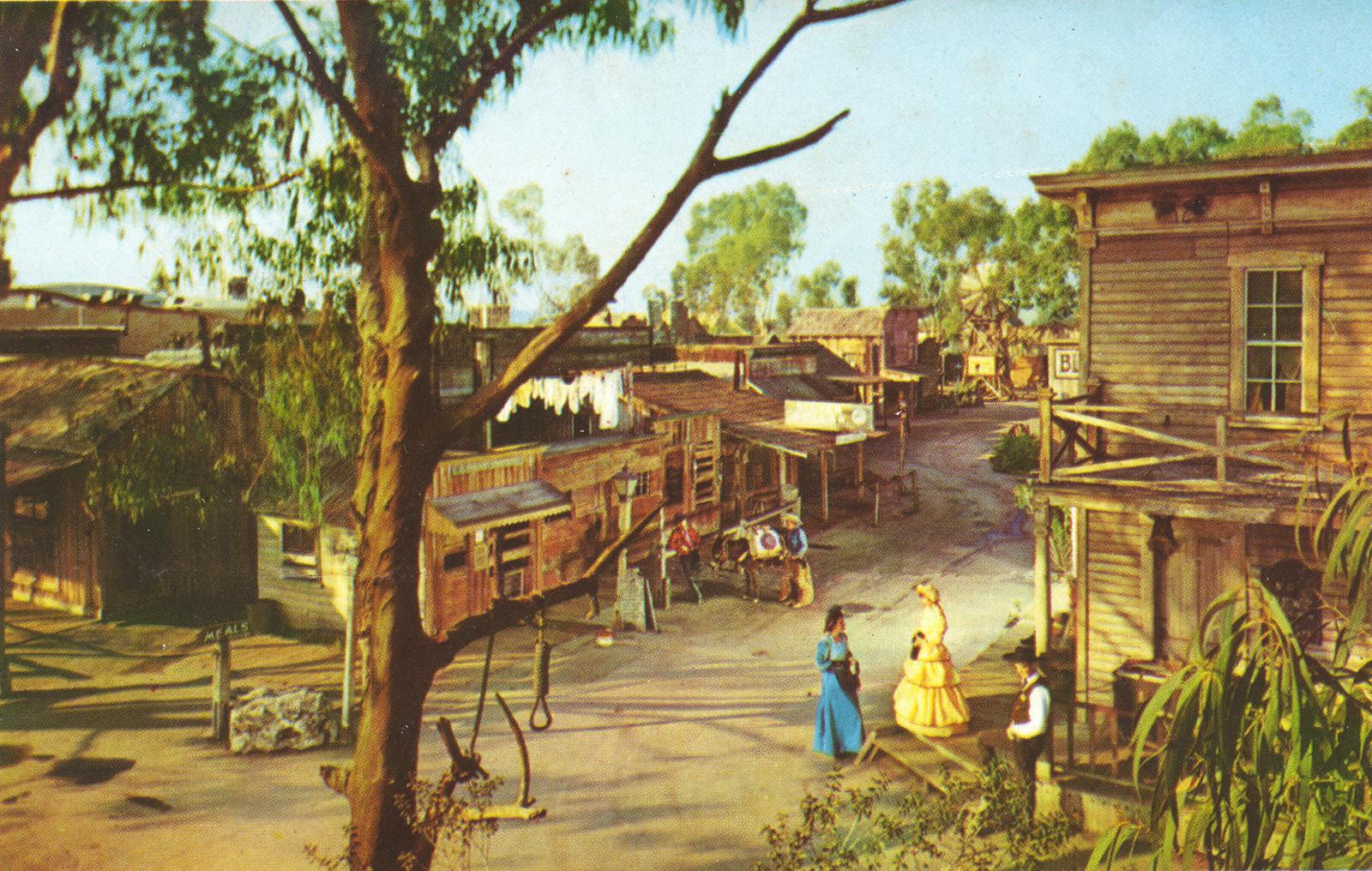 Main Street. Old west buildings and a tall tree with a noose.