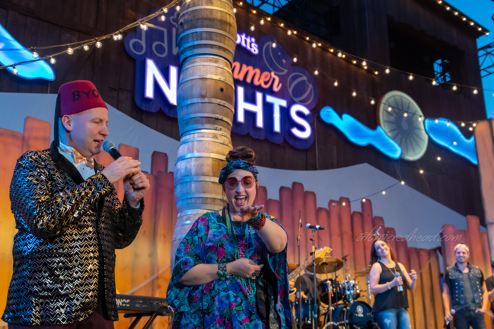 Head of the party planning committee, Duncan Disorderly, and fellow party planner Helen Highwater, introduce the band.