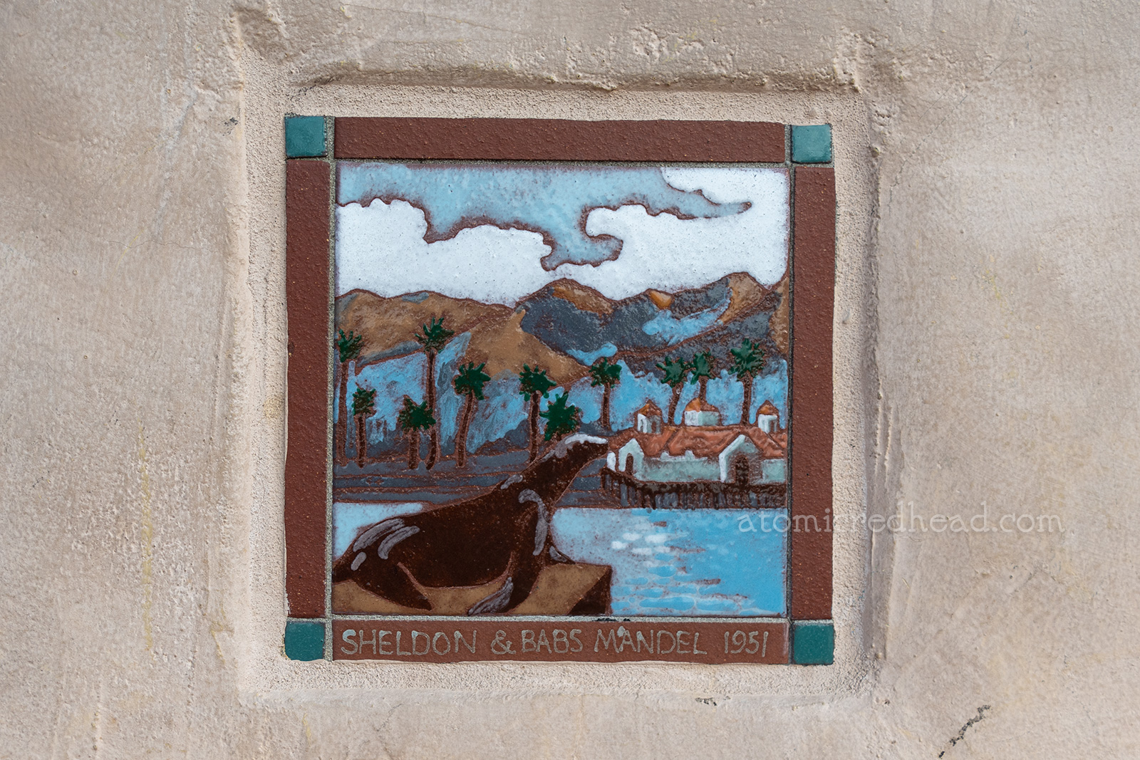 Close up of a tile of Old Ben sitting on a rock.