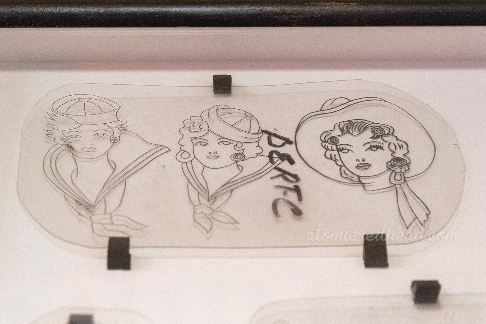 Acetate transfers for tattoos, featuring two female sailors and a cowgirl.