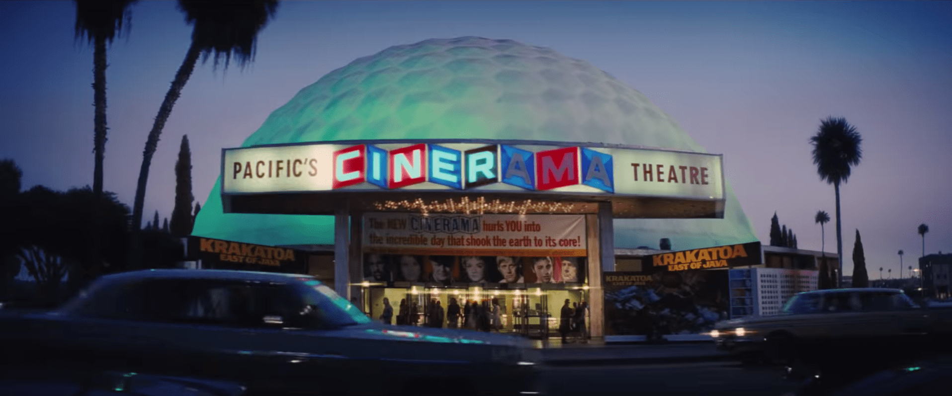 The Dome as seen in Once Upon a Time...in Hollywood, lit up at night, featuring the banner for Krakatoa East of Java. The dome is lite blue.