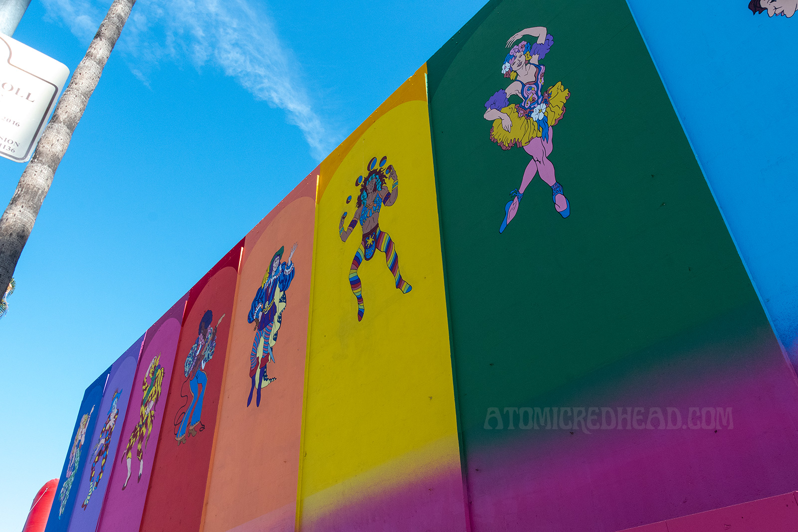 The multi colored panels with the various hippie characters.