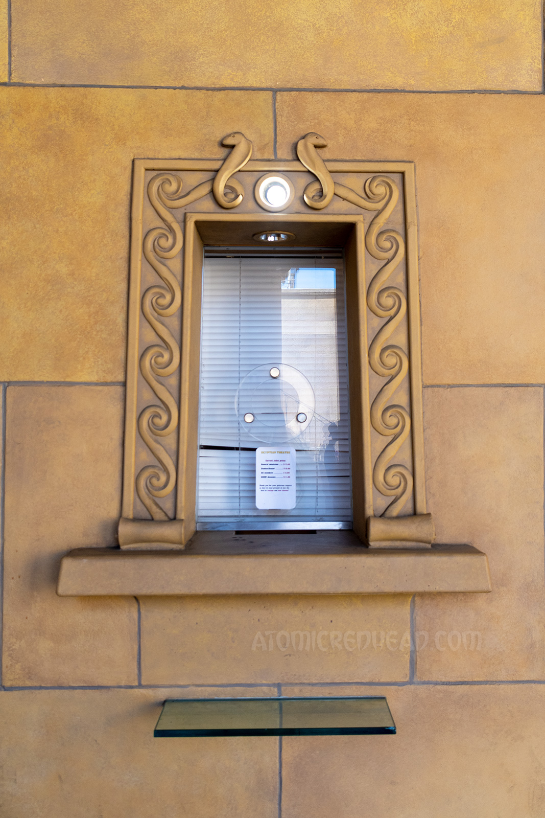 The ticket window, which is surrounded by raised images of cobras.
