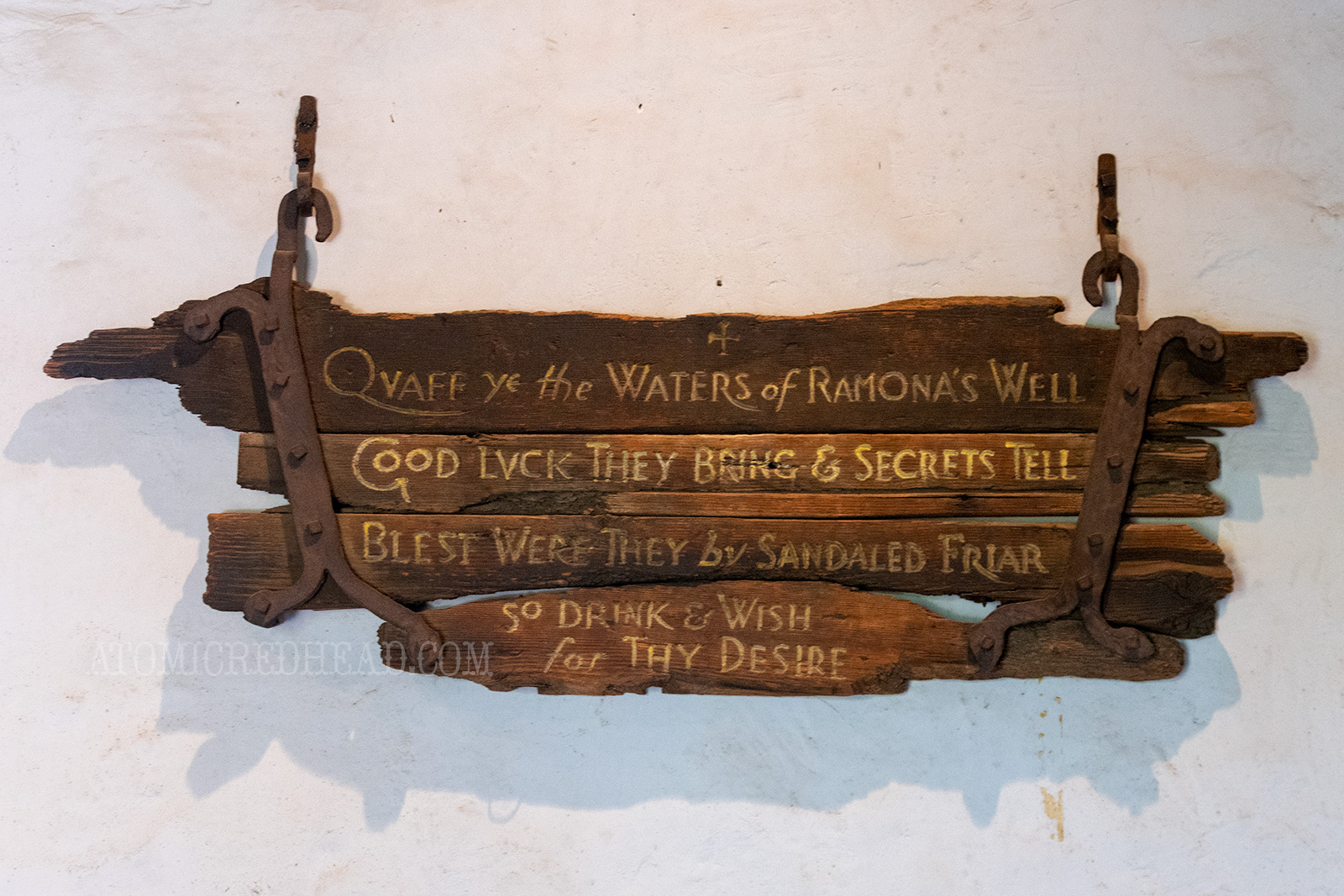 An old sign from the Ramona's Marriage Place days reading "Quaff ye the waters of Ramona's Well Good Luck they bring & secrets tell Blest were they by sandaled friar so drink & wish for thy desire"
