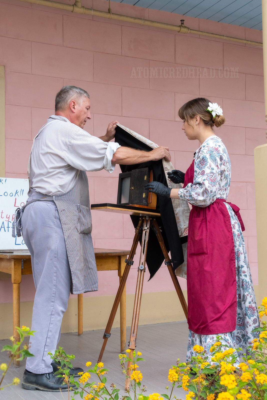 Catherine and her father prep the camera.