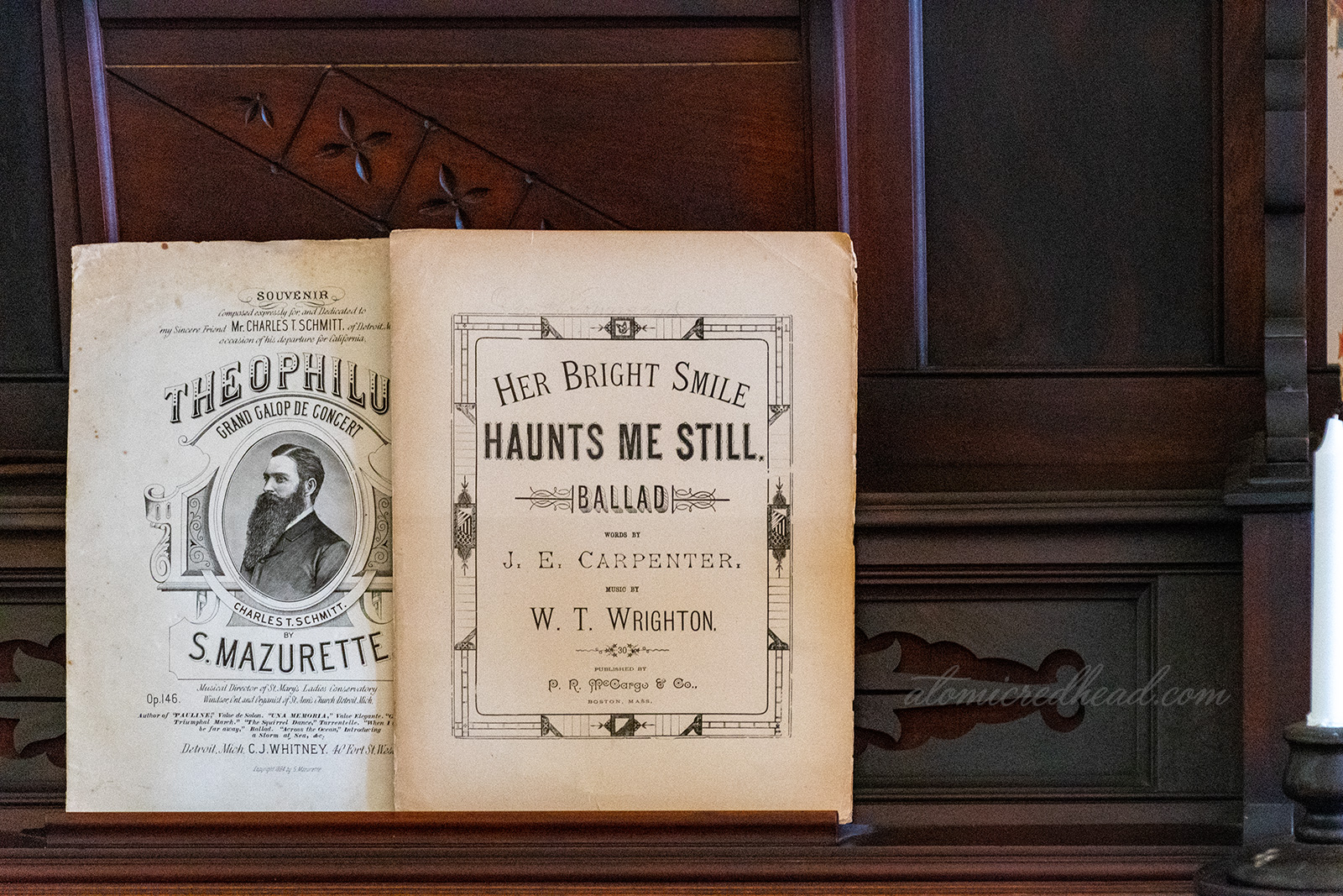 Sheet music for "Her Bright Smile Haunts Me Still" sits upon the organ.