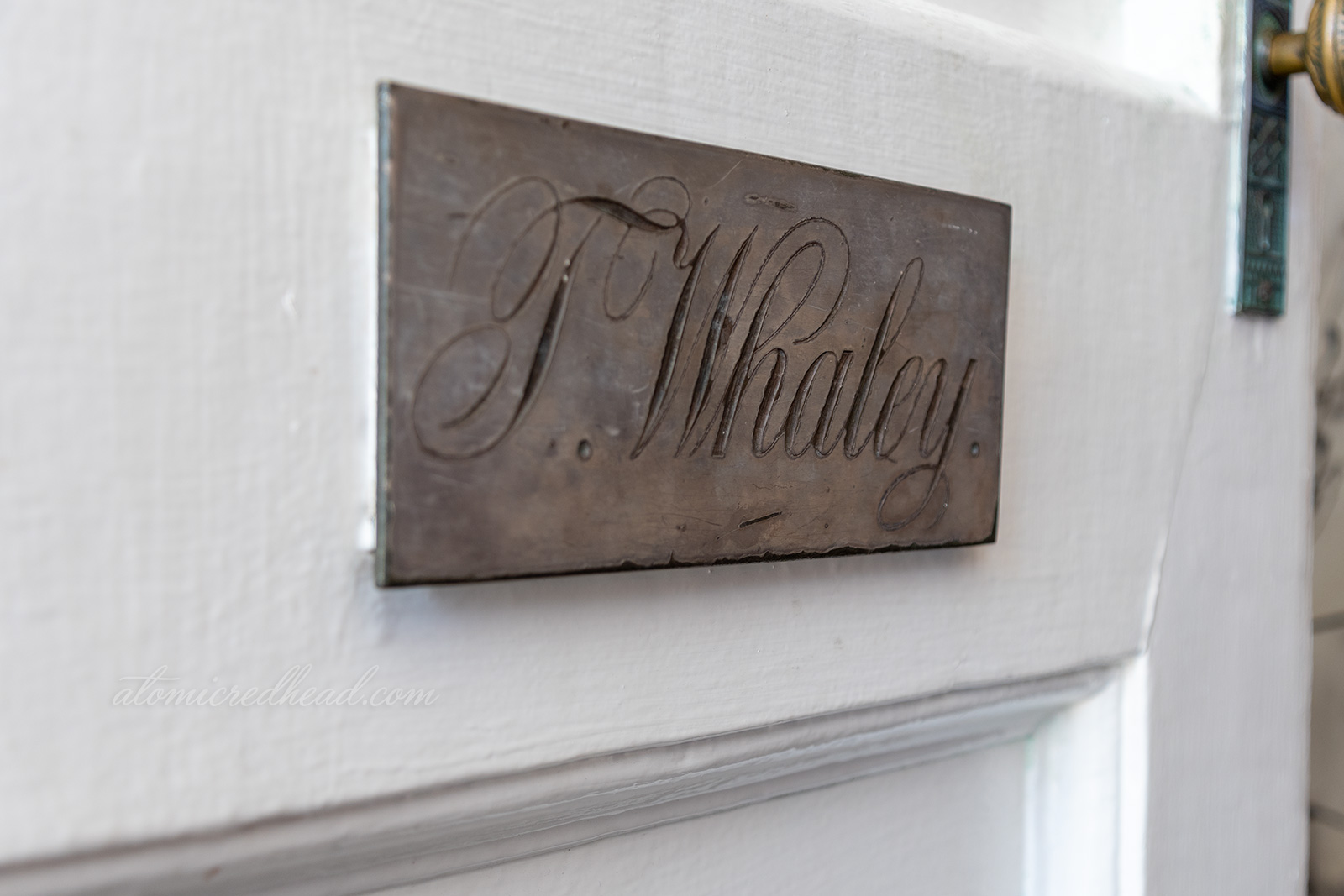 A plaque reading "T. Whaley" is affixed to the front door.