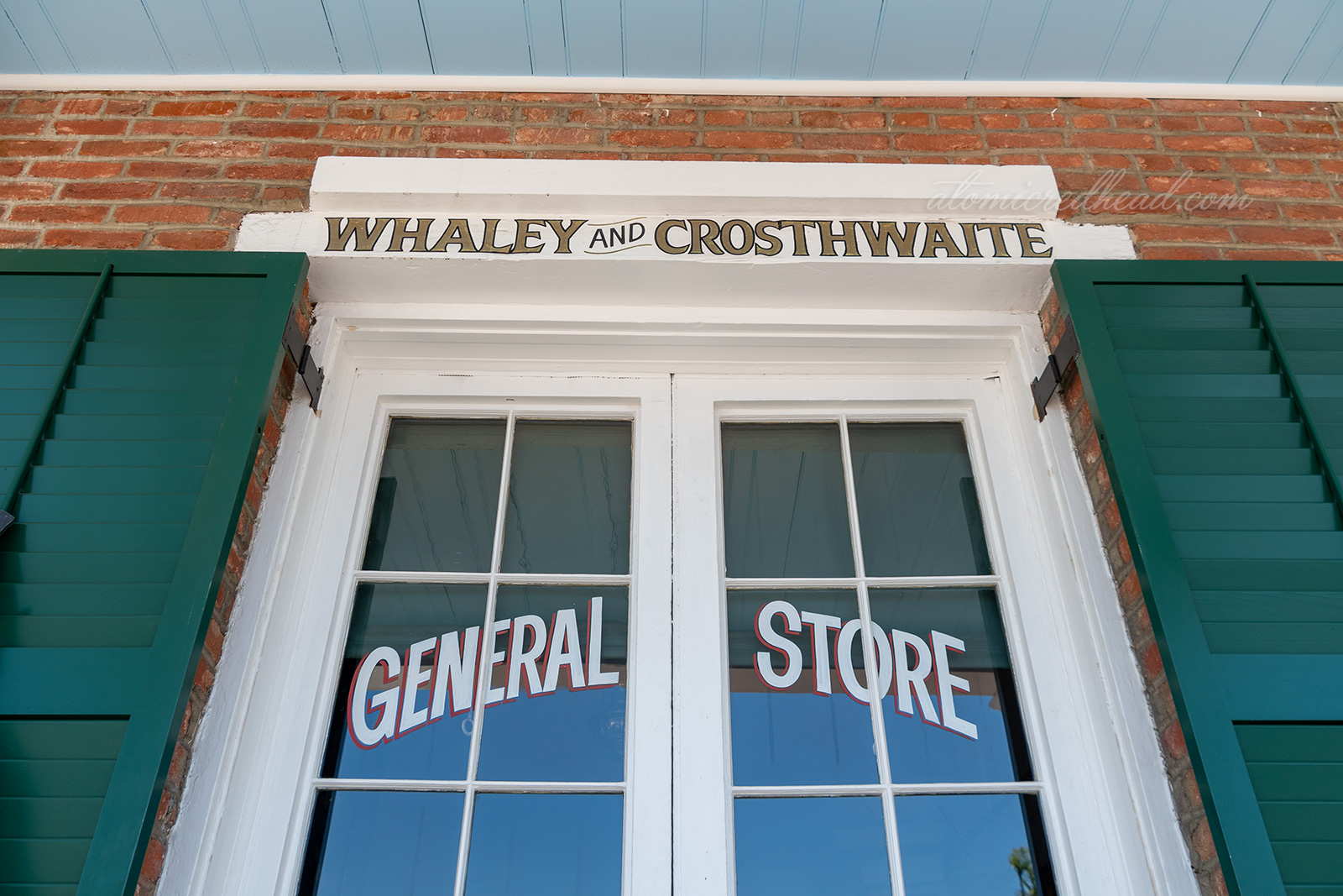 One window of the home features text reading "Whaley and Crosthwaite General Store"