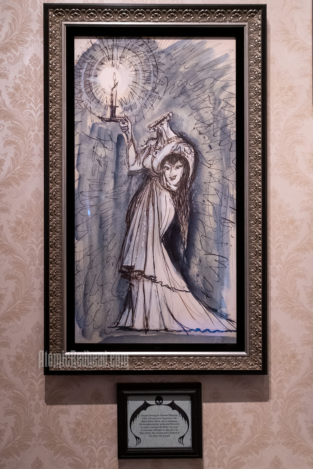 An illustration of of a woman, headless, but holding her head in her arm, her other hand holds a lit candle. She wears a white dress.