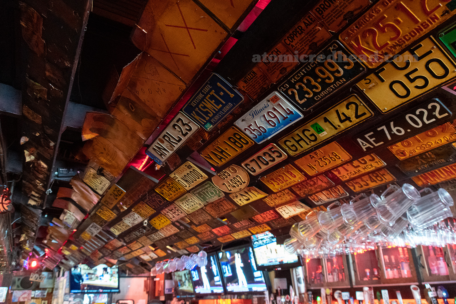 License plates hang on the wall above the bar.