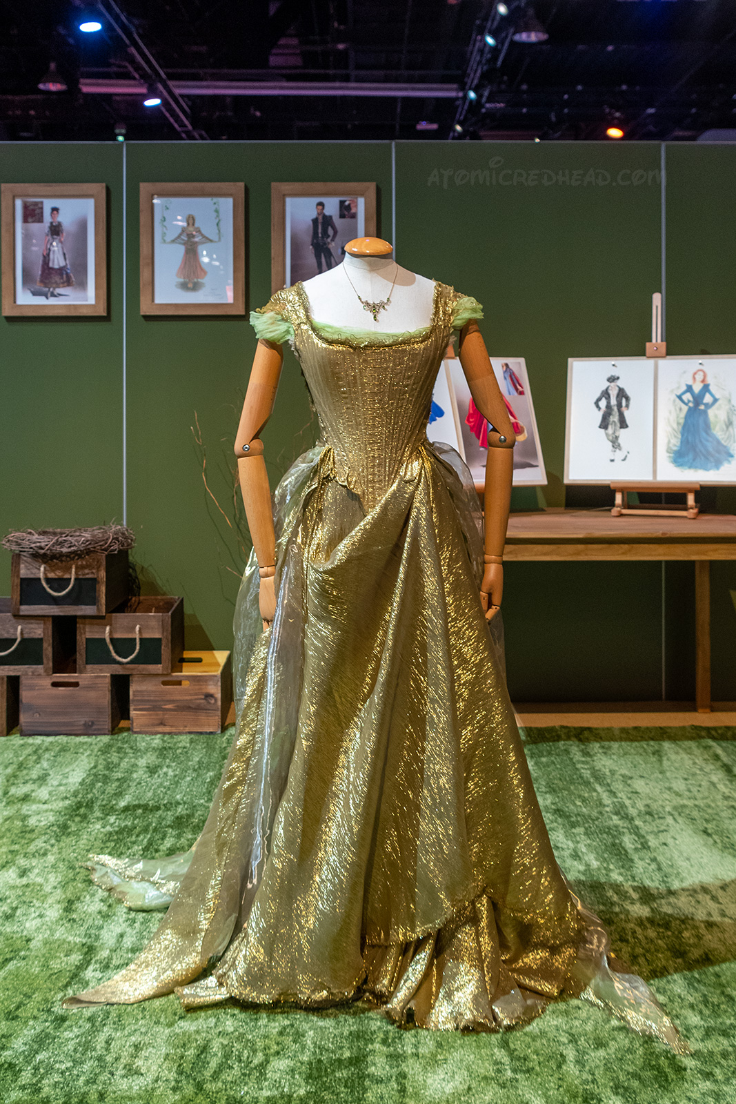 Cinderella's gown from Into the Woods, which is not very full, and gold. It features gathered cap sleeves.