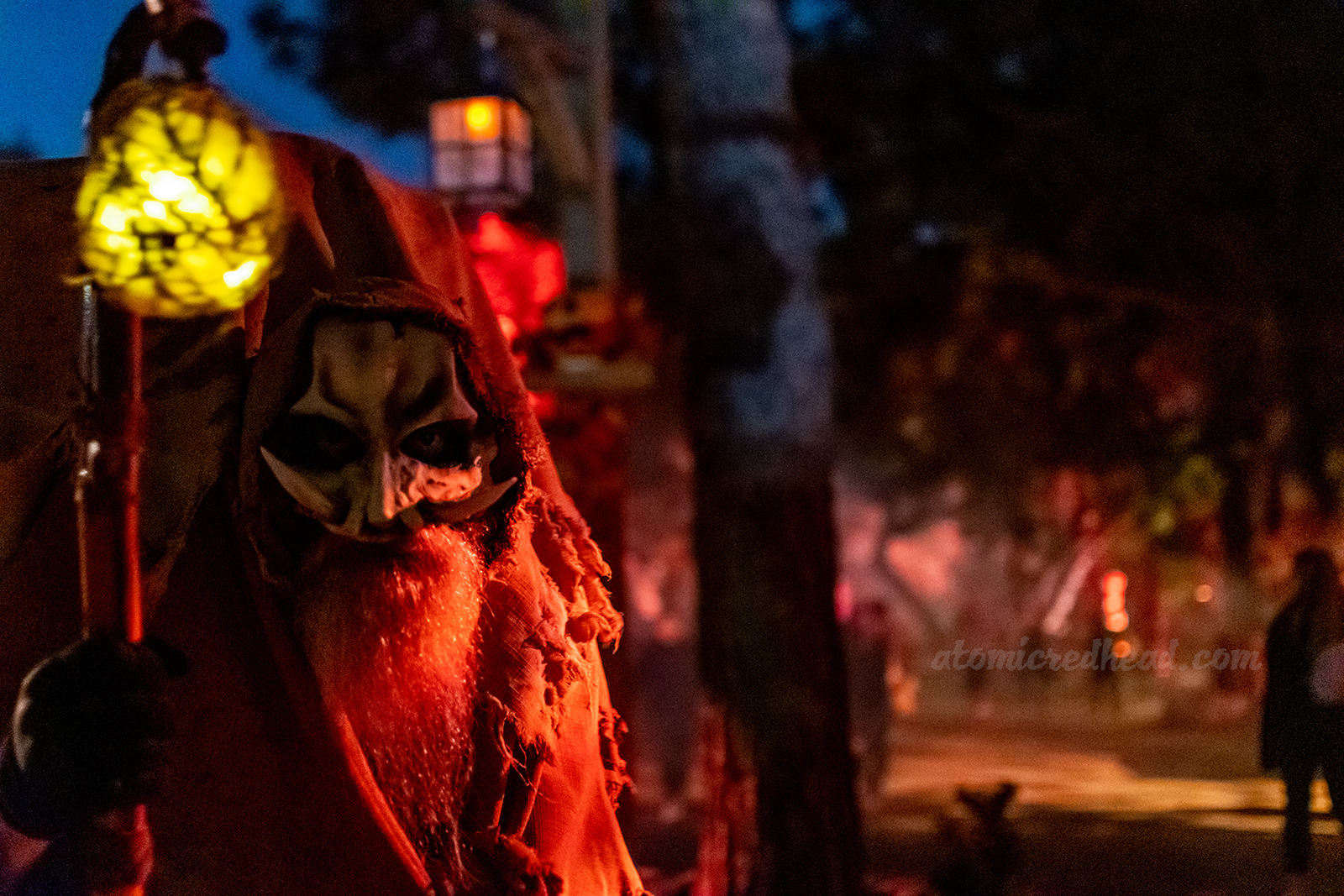 A nomad like creature with a beard and tusks gazes into the camera in The Hollow.