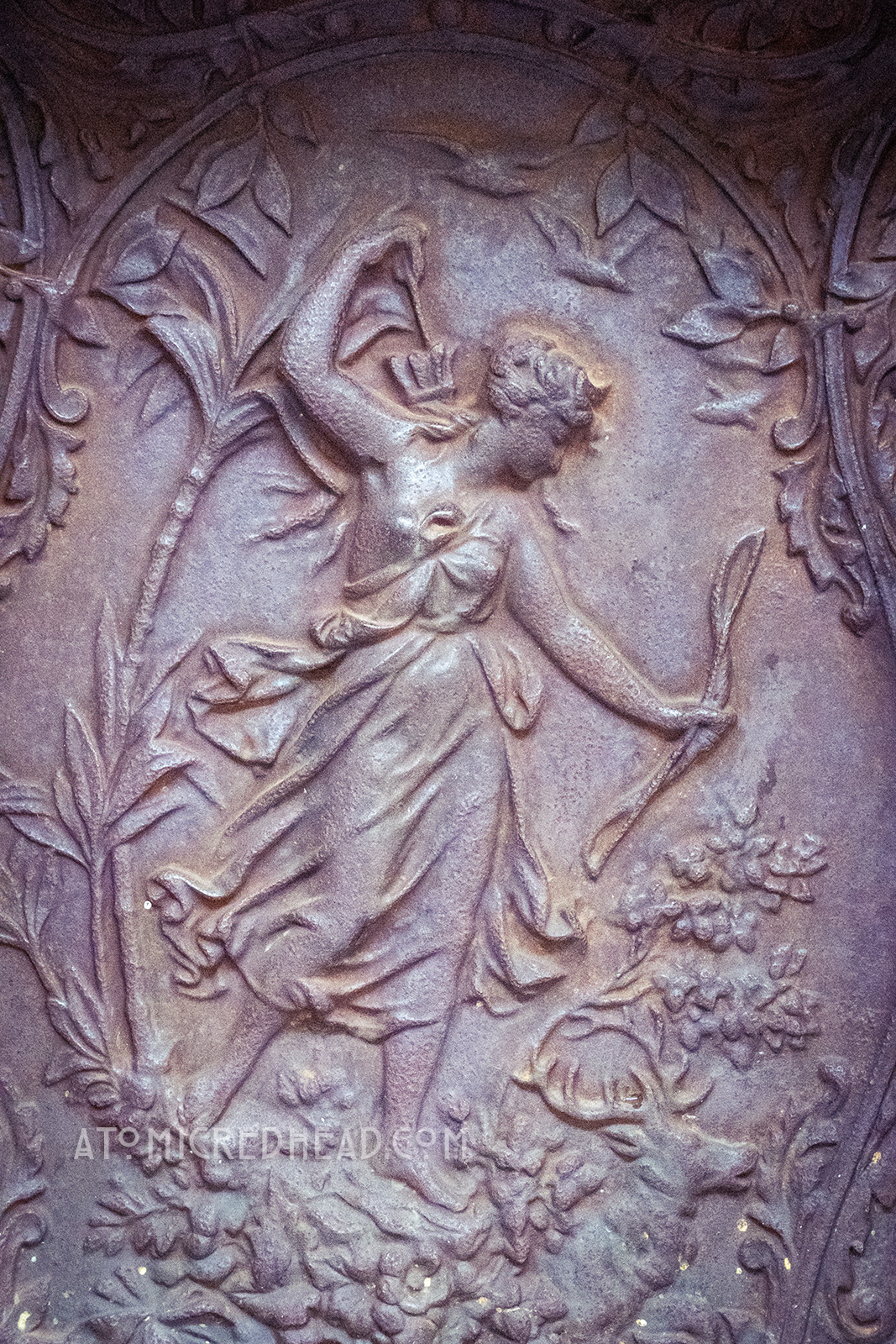 A metal panel of a female archer.