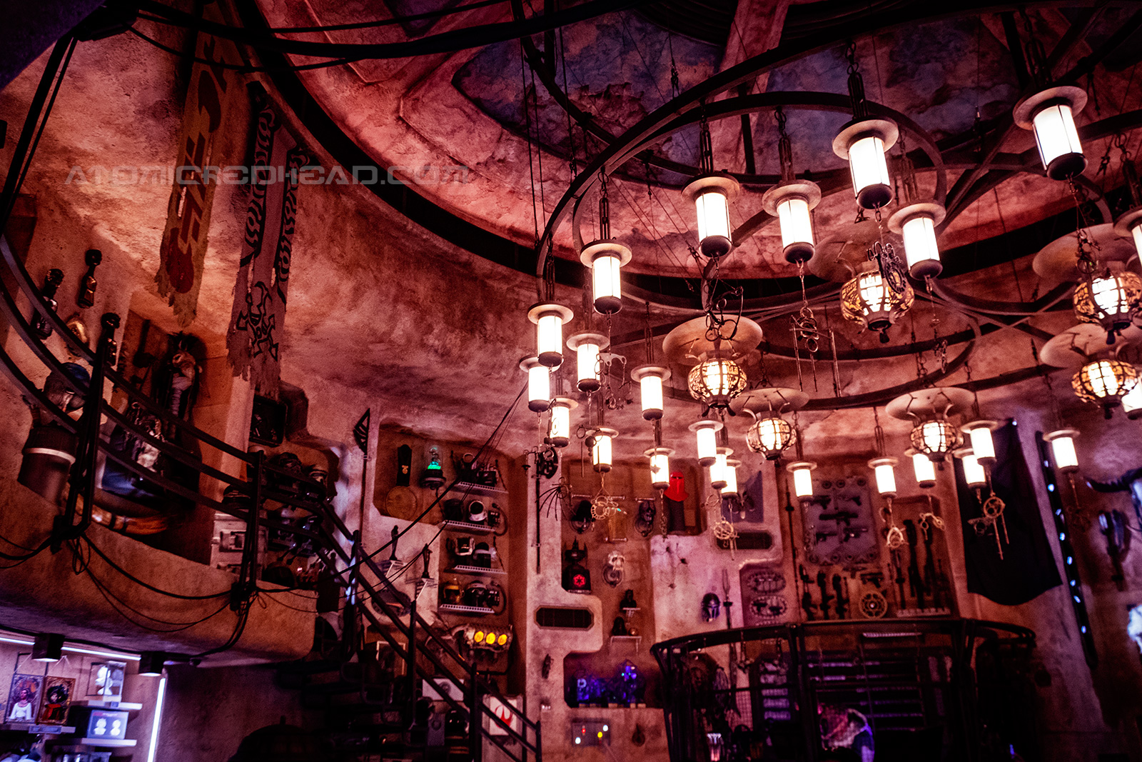 Inside the antiquities shop. Various artifacts hang on the wall, a massive chandelier hangs from the ceiling.