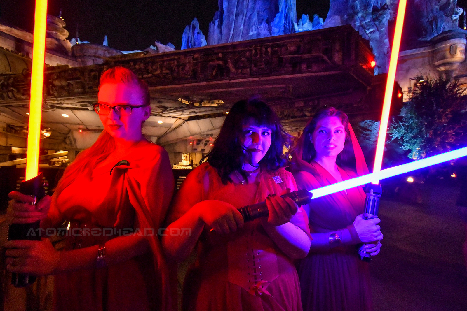 The three of us standing in front of the Falcon with our lightsabers.