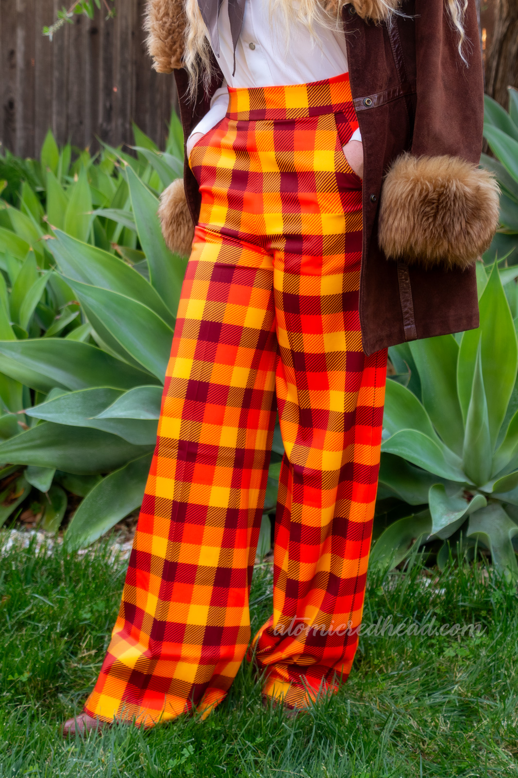 Close-up of my pants, which are yellow, orange, and brown plaid.