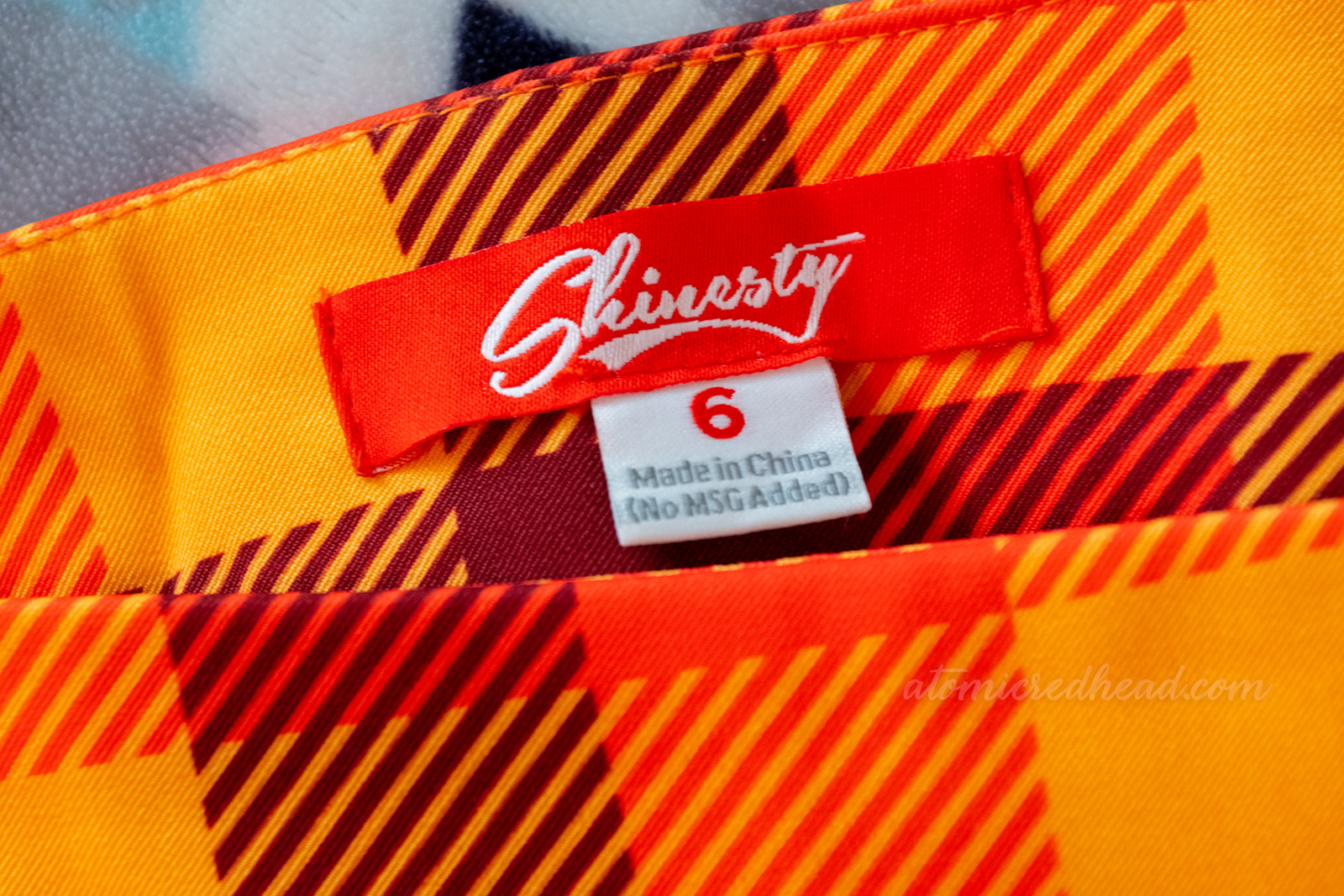 Close-up of the Shinesty label, reading size 6 and "Made in China"