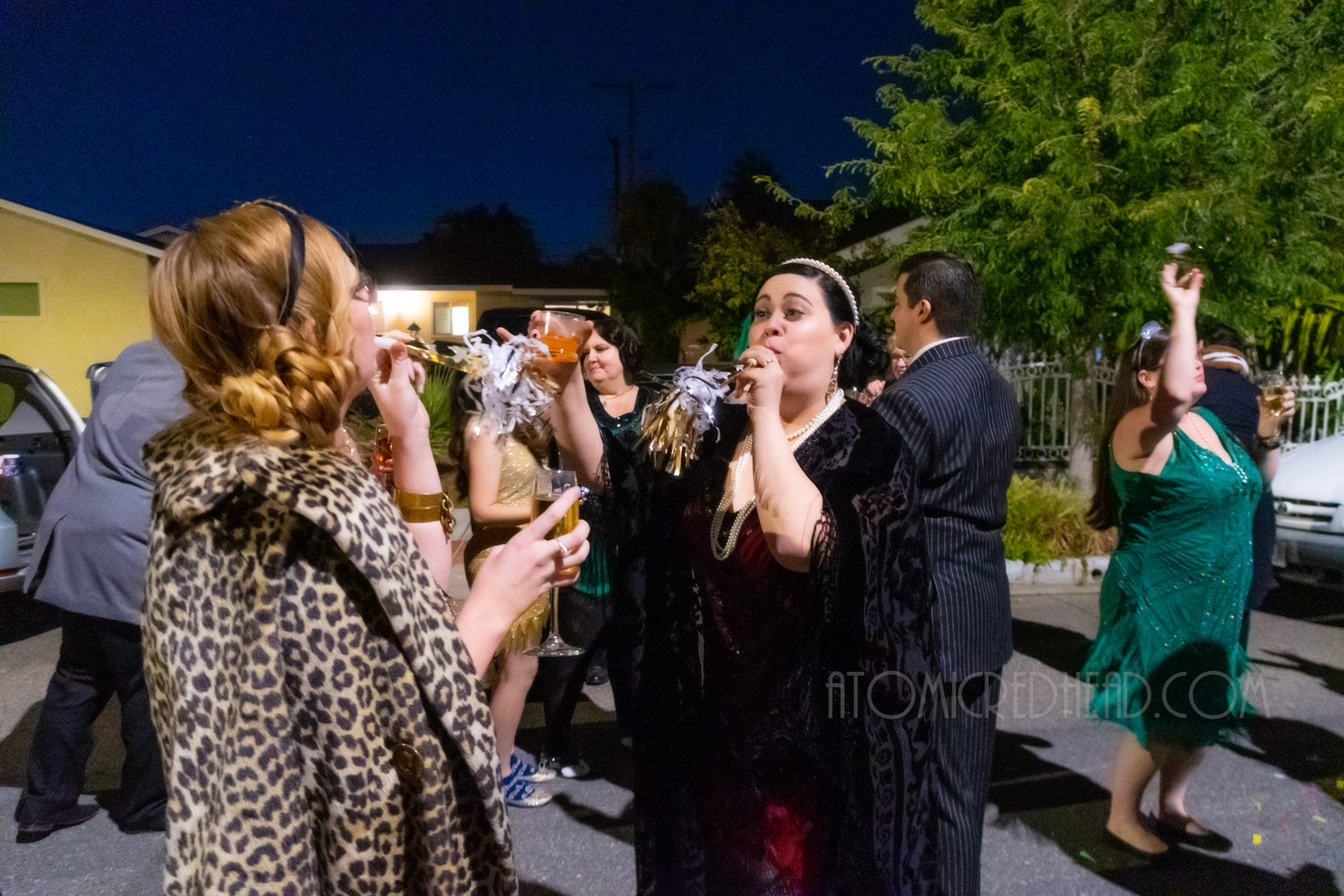 My friends and I ring in the new year outside with noise makers.